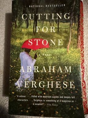 Cutting for Stone by Abraham Verghese – Green Cover with Red Umbrella